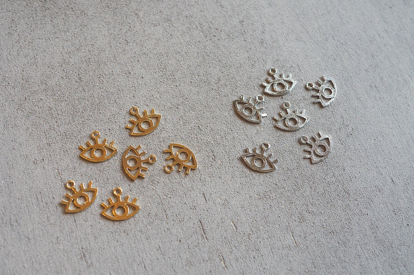 10 Augen Anhänger aus Messing, echt vergoldet / platiniert, 11mm x 13mm, Schmuckzubehör